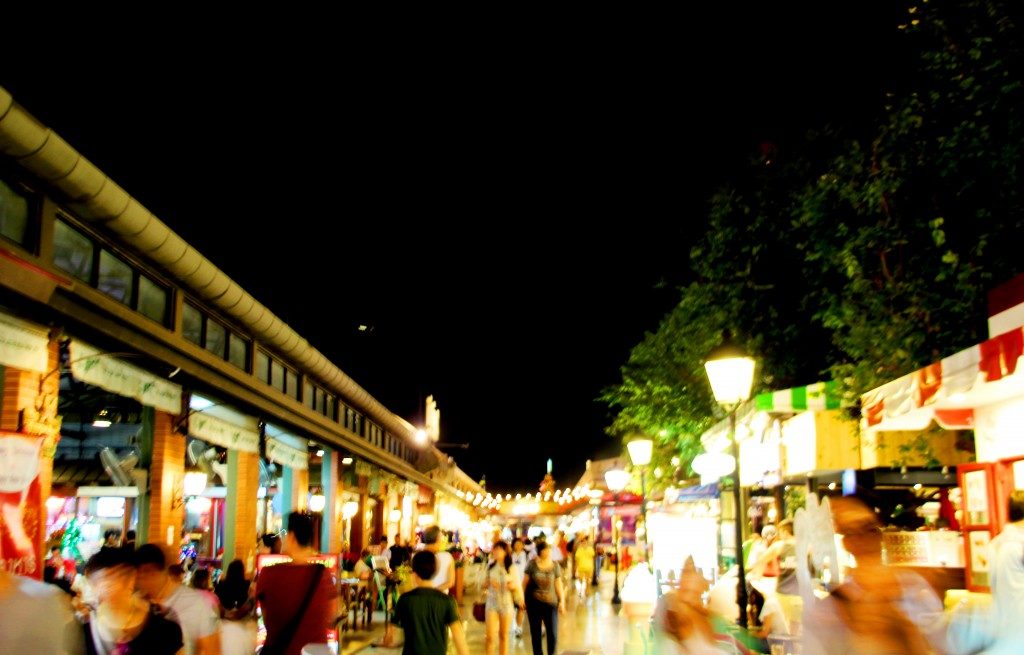 blurred moving shopper at night bazaar market