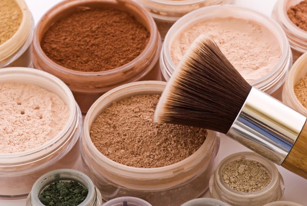 powdered make up and make up brush