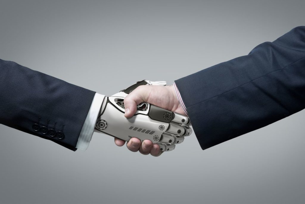 Business Human and Robot hands in handshake