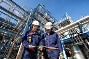 two industrial workers discussing